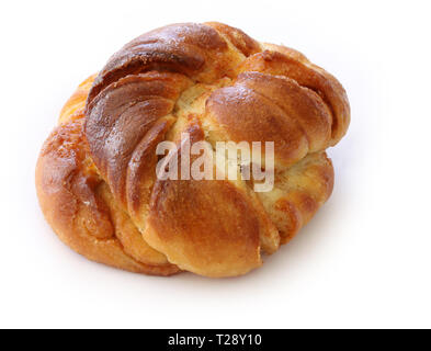 Freshly baked cinnamon bun. Cinnamon roll pastry on white background. Close up stock photo. Stock Photo