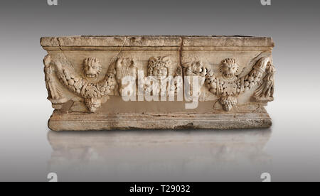 Roman relief garland sculpted sarcophagus.  Adana Archaeology Museum, Turkey. Against a grey background Stock Photo