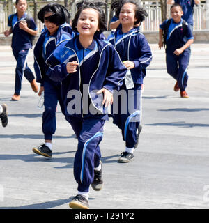 Thai school children visiting the Three Kings Monument in Chiang Mai, Thailand Stock Photo