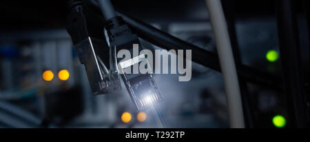 Website Header. Lan connectore close up. Datacenter server room background. RG-45 Stock Photo