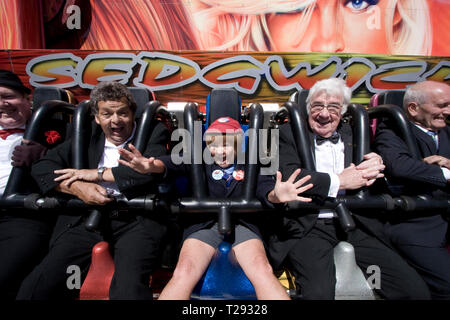 The Krankies pictured on a fairground ride on the Central Pier in Blackpool along with Frank Carson. The veteran comedians and entertainers were promoting their forthcoming show entitled the Best of British Variety Tour 2008, which also featured Frank Carson, Cannon & Ball, Paul Daniels, Brotherhood of Man and Jimmy Cricket. The duo comprised husband and wife Janette and Ian Tough and as the Krankies they portrayed schoolboy Wee Jimmy Krankie (Janette), and Jimmy's father (Ian), though in their comedy act they also portray other characters. Stock Photo