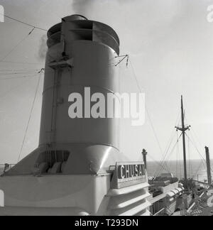 1950s, a funnel on the P  & O ship, the SS Chusan cruising the Norweigan fjords. Stock Photo