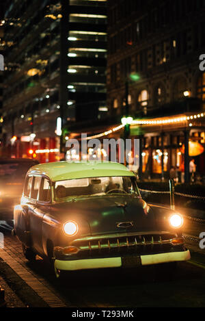 A vintage car on Main Street in downtown Houston, Texas Stock Photo