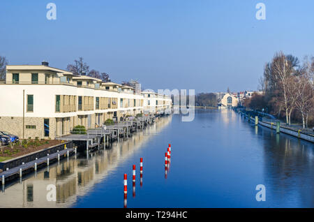 Berlin, Germany - February 9, 2018: Newly erected settlement on the island Humboldtinsel along the street Am Tegeler Hafen on the banks of the frozen  Stock Photo