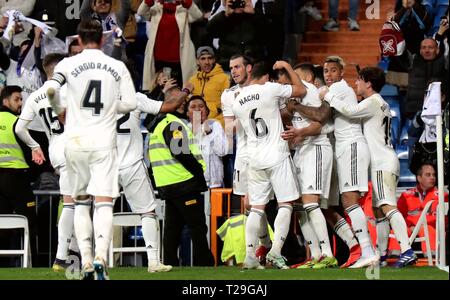 Madrid, Spain. 31st Mar, 2019. Players of Real Madrid celebrate during a Spanish league soccer match between Real Madrid and Huesca in Madrid, Spain, on March 31, 2019. Real Madrid won 3-2. Credit: Edward F. Peters/Xinhua/Alamy Live News Stock Photo