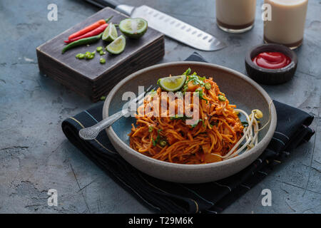 Indian mee goreng or mee goreng mamak, Indonesian and Malaysian cuisine, spicy fried noodles in a plate, copy space. Stock Photo