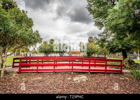 ORLANDO, FLORIDA, USA - DECEMBER, 2018: Red Bridge at Eola Lake Park, popular destination for festivals, concerts, fundraising walks and even weddings Stock Photo