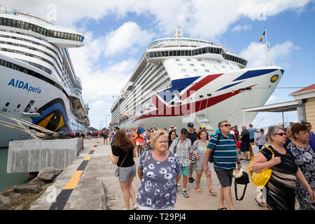 Aida Perla and Brittania cruise ships moored alongside each other in St Kitts in the Caribbean Stock Photo