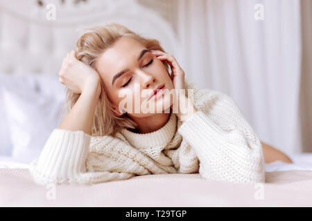 Woman With Short Hair Cut Closing Her Eyes Tight While Getting Hit