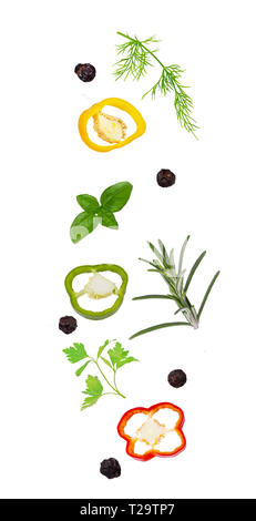 Flying vegetable concept. Fresh organic sweet pepper and herbs isolated on white background with clipping path as package design element and advertisi Stock Photo