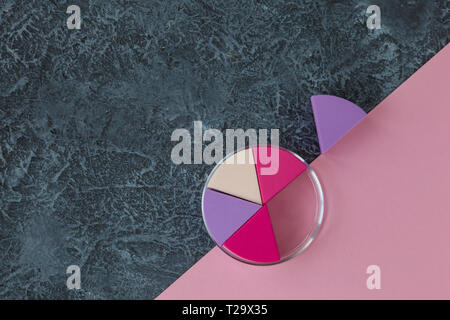 Make up sponges on dark stone background. Cosmetic applicator. Pink paper with copy space Stock Photo