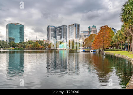 ORLANDO, FLORIDA, USA - DECEMBER, 2018: Eola Lake Park with vibrant autumn fall colors, located at Downtown Orlando. Stock Photo