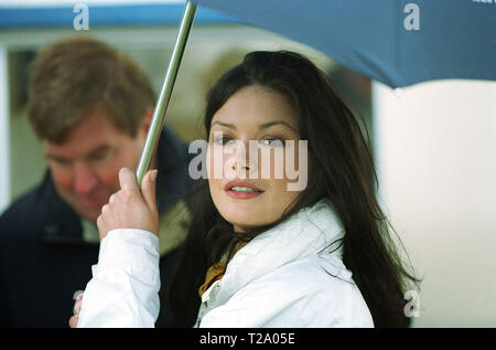 Catherine Zeta-Jones pictured at the Old Course, St. Andrews sheltering under an umbrella while husband Michael Douglas  played a pro-celebrity golf event before the Alfred Dunhill Cup. Stock Photo