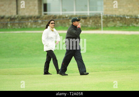 Catherine Zeta-Jones and husband Michael Douglas pictured  at the Old Course, St. Andrews during the actor's round at the annual Dunhill pro-celebrity golf tournament where he partnered Ernie Els. Stock Photo