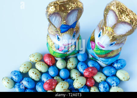 Two chocolate easter bunnies and chocolate easter eggs Stock Photo