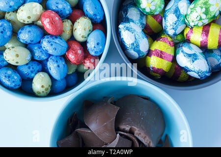 Chocolate easter eggs and pieces of a chocolate easter bunny Stock Photo