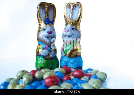Two chocolate easter bunnies and chocolate easter eggs Stock Photo