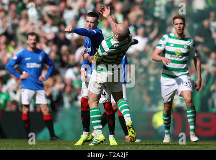 Rangers' Ryan Kent (left) and Celtic's Scott Brown clash during the Ladbrokes Scottish Premiership match at Celtic Park, Glasgow. Stock Photo