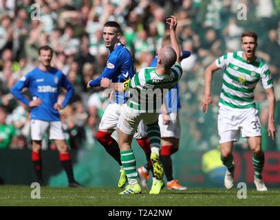 Rangers' Ryan Kent (left) and Celtic's Scott Brown clash during the Ladbrokes Scottish Premiership match at Celtic Park, Glasgow. Stock Photo