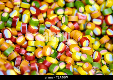 Colorful lollipops and different colored round candy. Top view. Stock Photo