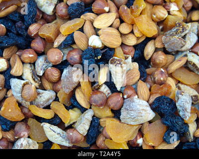 dried fruits and mixed cookie background. top view organic food. cookie stack Stock Photo