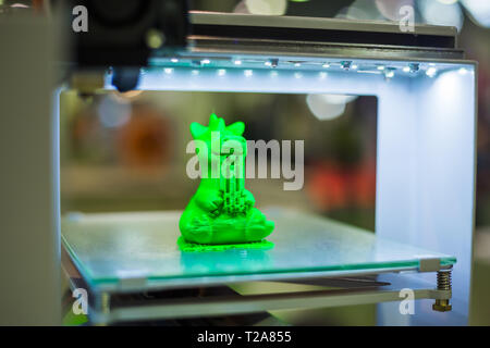 Modern 3D printer machine printing plastic model Stock Photo