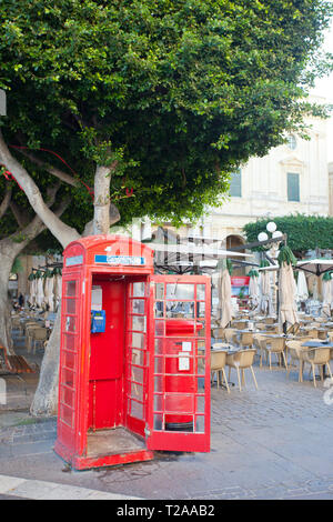 Old red Phone Booth outside restaurant Stock Photo