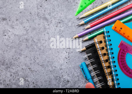 School supplies on the desk with copy space. Top view on pencils, notebooks and rulers Stock Photo