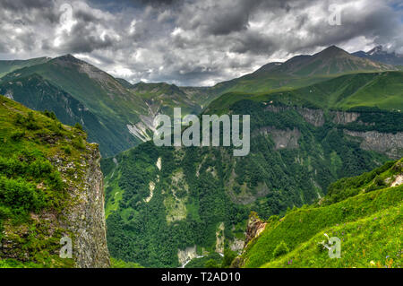 Beautiful colourful mountains viewed from the Russia Georgia Friendship Monument in Kazbegi, Georgia Stock Photo