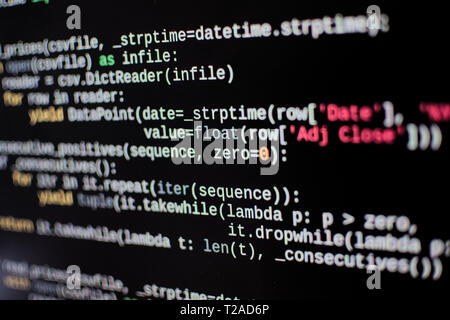 Source code lines on a computer screen. Screen pixels can be seen. Stock Photo