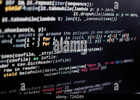 Source code lines on a computer screen. Screen pixels can be seen. Stock Photo