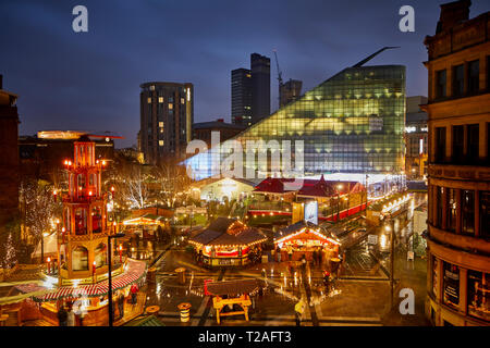 Early evening night at Manchester city centre European German Christmas Markets 2018 Ice Village in Cathedral Gardens - German Erzgebirge Pyramid Stock Photo