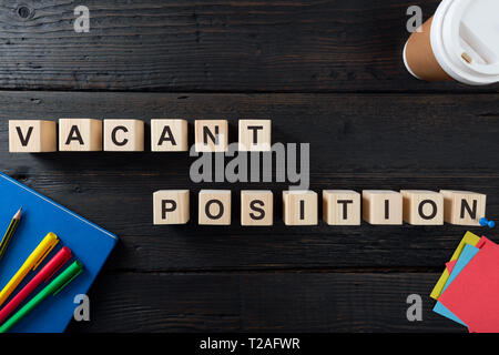 Words VACANT POSITION on a wooden blocks. Human Resources and personnel hiring concept Stock Photo