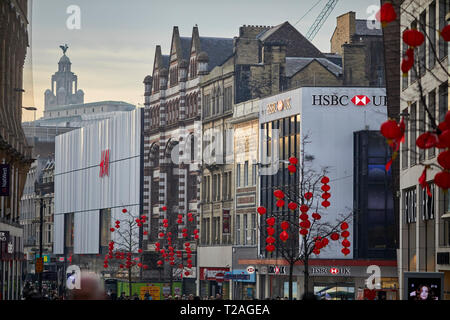 Liverpool Lord Street main shopping high street lined with banks and chains, decorated for Chinese New Year with red lanterns Stock Photo