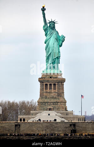 Landmark Statue of Liberty neoclassical sculpture on Liberty Island in the harbor harbour taken from a passing Staten Island Ferry USA  Manhattan, New Stock Photo