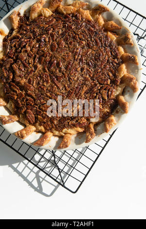 Pecan pie on cooling rack Stock Photo