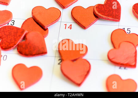 Red hearts on Valentine's Day box on calendar Stock Photo