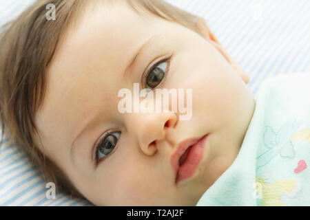 Close up of boy lying down Stock Photo