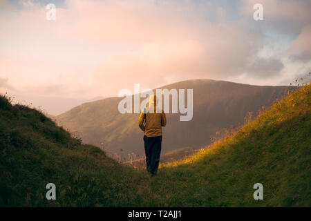 Rear view of man hiking in the Carpathian Mountain Range Stock Photo
