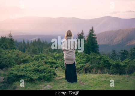 Woman wrapped in blanket in the Carpathian Mountain Range Stock Photo