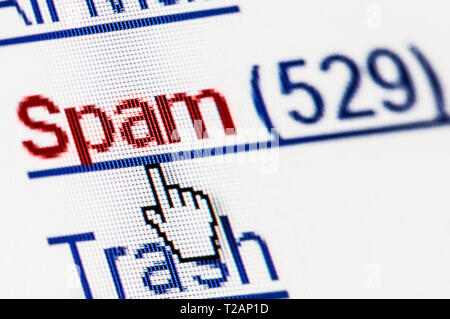 Spam junk e-mail box on pixelated computer screen. Macro shot Stock Photo