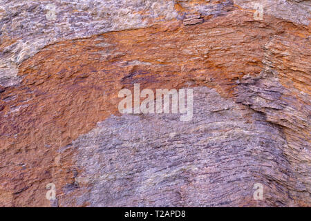 Stone texture background with unique pattern. Brown and gray dirty rock texture. Rock surface abstract background. Natural stone background. Rough Stock Photo