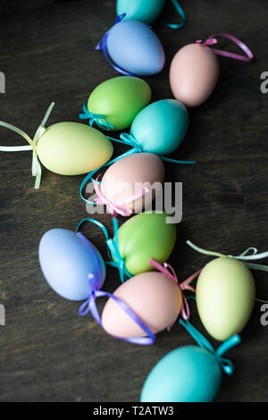 Easter holiday natural composition with first spring flowers like tricolor violas and primerose , colored eggs Stock Photo