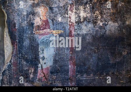 Figure of a woman painted in a Cool on black background in a Domus of Pompeii, the ancient Roman city of Pompeii, a UNESCO heritage site, destroyed by Stock Photo