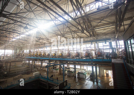 Theme industry and processing of agricultural crops. Equipment and machinery inside the old sugar factory of Soviet times Stock Photo