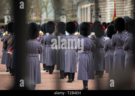 LONDON, UK - MARCH 22, 2019: The Royal Guards marching during the parade at the Changing of the Guard ceremony across Buckingham Palace Stock Photo