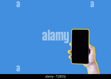 Collage in magazine style and pop art style. Hand holding smartphone over blue background Stock Photo