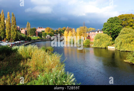 The River Severn passing through Shrewsbury in Shropshire, England. Photographed during a sunny period before a rain storm hits. Stock Photo