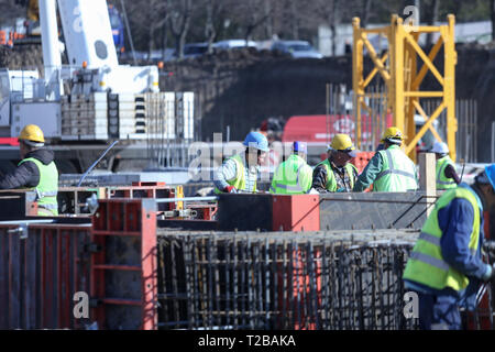 Bucharest, Romania - March 19, 2019: Workers on a construction site Stock Photo