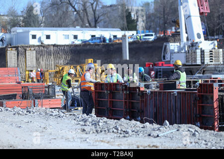 Bucharest, Romania - March 19, 2019: Workers on a construction site Stock Photo